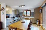 This charming kitchen boasts a warm and inviting atmosphere, perfect for family gatherings and culinary adventures.