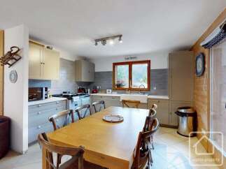 This charming kitchen boasts a warm and inviting atmosphere, perfect for family gatherings and culinary adventures.