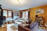 Discover the charm of this cozy living room, perfect for relaxing after a day on the slopes.