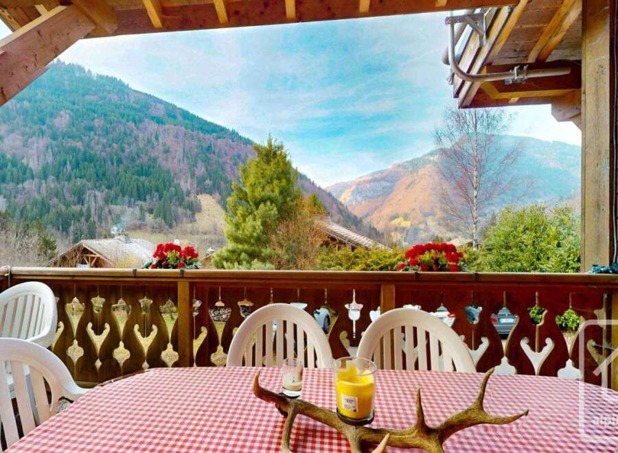 Enjoy breathtaking mountain views from this charming balcony.