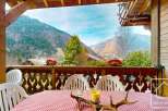 Enjoy breathtaking mountain views from this charming balcony.