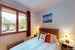 This cozy bedroom offers a comfortable retreat with a charming ambiance.