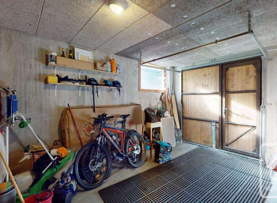 This spacious garage offers ample storage space for vehicles, tools, and equipment.