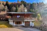 Discover this charming chalet nestled in a serene mountain setting, perfect for a peaceful retreat.