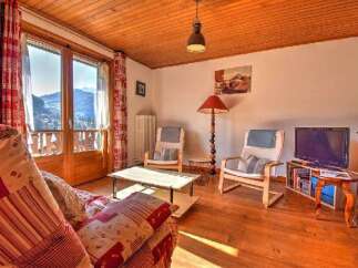 This charming property boasts a cozy living space with a warm, inviting atmosphere.