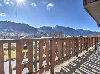 Enjoy breathtaking mountain views from this charming property.