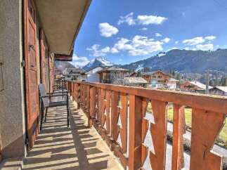 Enjoy breathtaking mountain views from this charming balcony.
