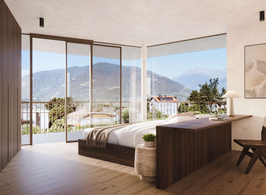 Experience luxury living with this stunning bedroom featuring breathtaking mountain views.
