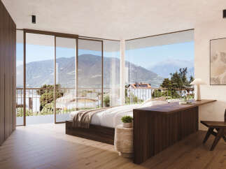 Experience luxury living with this stunning bedroom featuring breathtaking mountain views.
