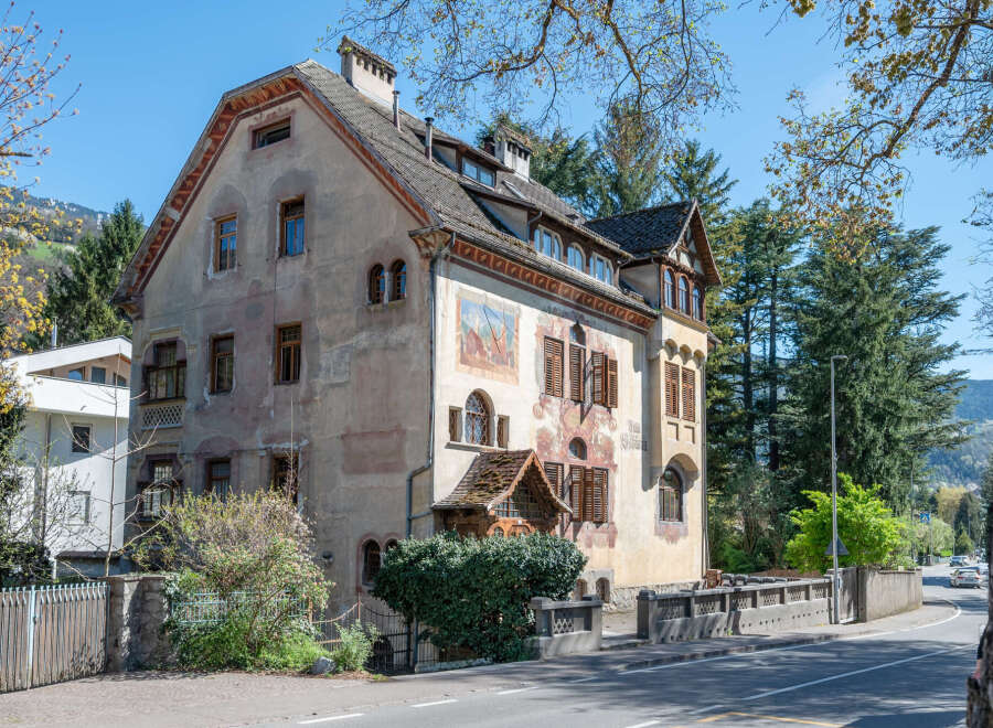 This stunning property showcases classic architectural design with its unique facade and intricate details.
