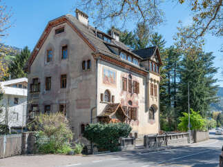 This stunning property showcases classic architectural design with its unique facade and intricate details.