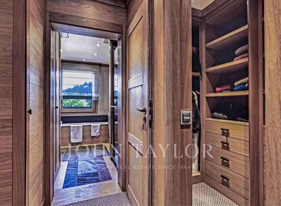 Step into luxury with this stunning property featuring exquisite wooden details throughout.