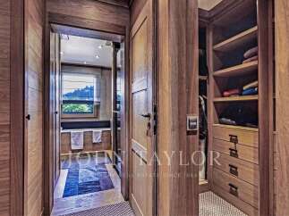 Step into luxury with this stunning property featuring exquisite wooden details throughout.