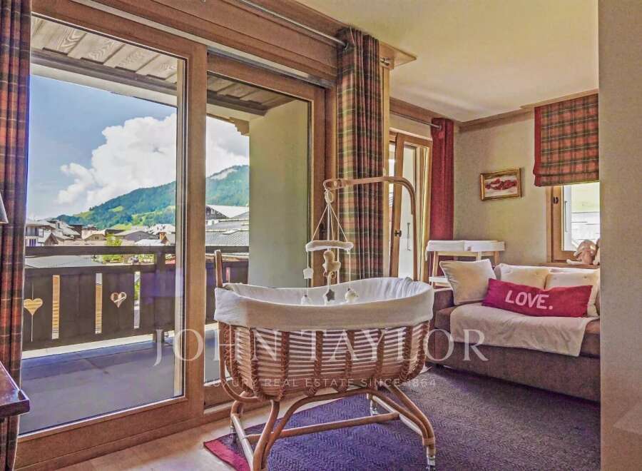 Discover the charm of this exquisite property, featuring a cozy nursery with stunning mountain views.