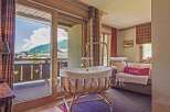 Discover the charm of this exquisite property, featuring a cozy nursery with stunning mountain views.
