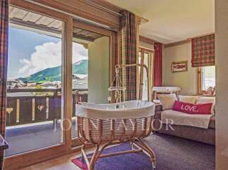 Discover the charm of this exquisite property, featuring a cozy nursery with stunning mountain views.