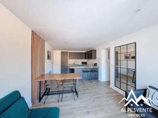 Discover modern living in this stylish property, featuring a sleek kitchen with a breakfast bar and contemporary design.