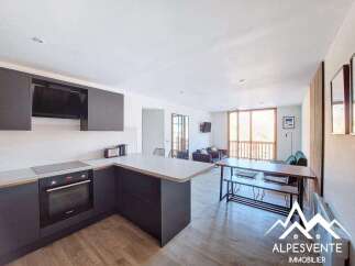 Discover modern living in this stylish property, featuring a sleek kitchen with integrated appliances and ample counter space.