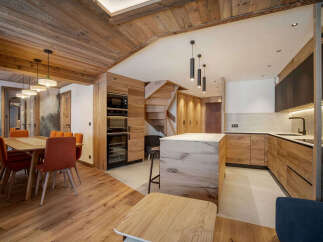 Experience the warmth and elegance of this stunning kitchen and dining area.
