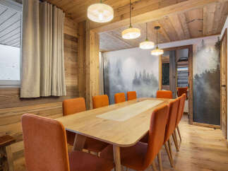 Step into this stunning dining room, where rustic charm meets modern elegance.