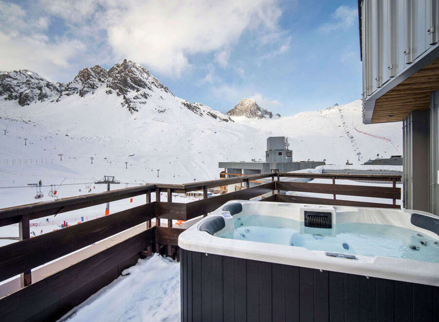 Enjoy breathtaking mountain views from this luxurious property featuring a private hot tub.