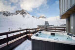Enjoy breathtaking mountain views from this luxurious property featuring a private hot tub.