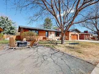 This charming brick home offers a blend of modern design and classic appeal.