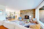 Step into this inviting living space, featuring a cozy fireplace and a stylish, open layout.