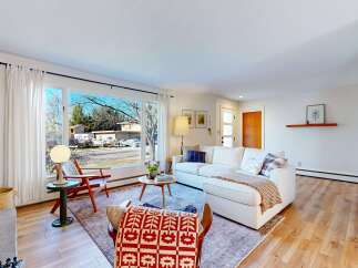 Step into this inviting living space, featuring a cozy fireplace and abundant natural light.