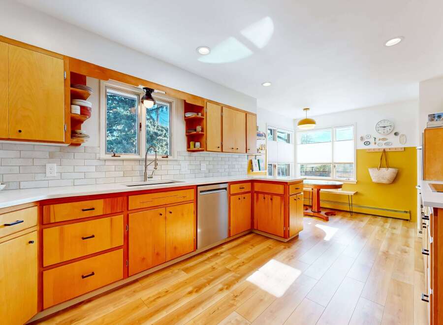 This stunning kitchen boasts a modern design with sleek cabinetry and ample storage.