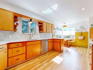 This stunning kitchen boasts a modern design with sleek cabinetry and ample storage.