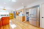 Step into this stunning kitchen, boasting a modern design with sleek stainless steel appliances and ample counter space.