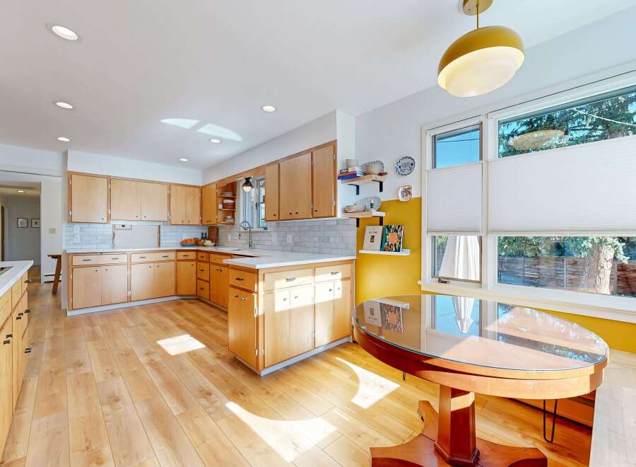 This stunning kitchen boasts a bright and airy atmosphere with its light wood cabinetry and flooring.