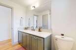 Step into this beautifully designed bathroom, featuring a modern vanity with ample storage and a sleek countertop.