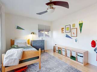 This charming bedroom offers a cozy and inviting atmosphere, perfect for a child's retreat.