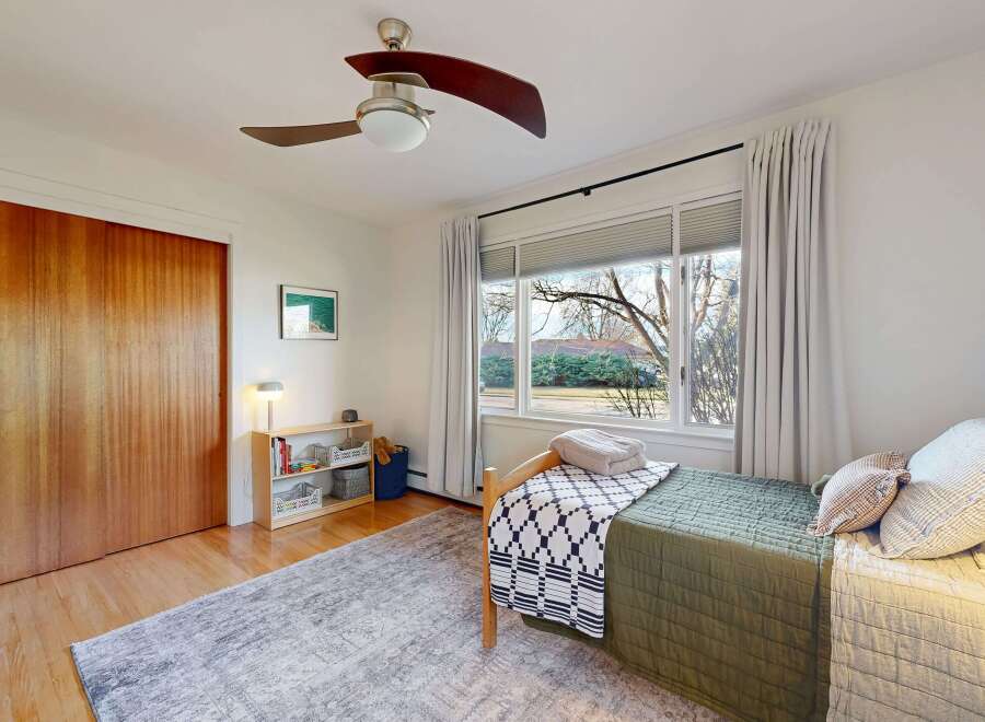 This inviting bedroom features a cozy bed with stylish bedding and a calming color palette.