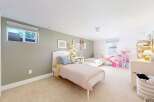 This charming bedroom features two twin beds, perfect for a shared space or guest room.