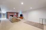 Step into this inviting living space, featuring a cozy fireplace and a comfortable sofa, perfect for relaxing evenings.