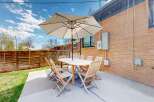 Enjoy outdoor living at its finest with this charming patio space.