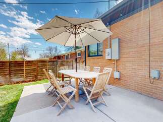 Enjoy outdoor living at its finest with this charming patio space.