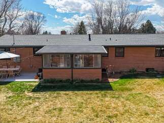 This stunning property boasts a beautifully designed brick exterior, offering timeless appeal and durability.