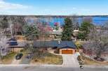 This stunning property offers a serene lakeside living experience with breathtaking views.