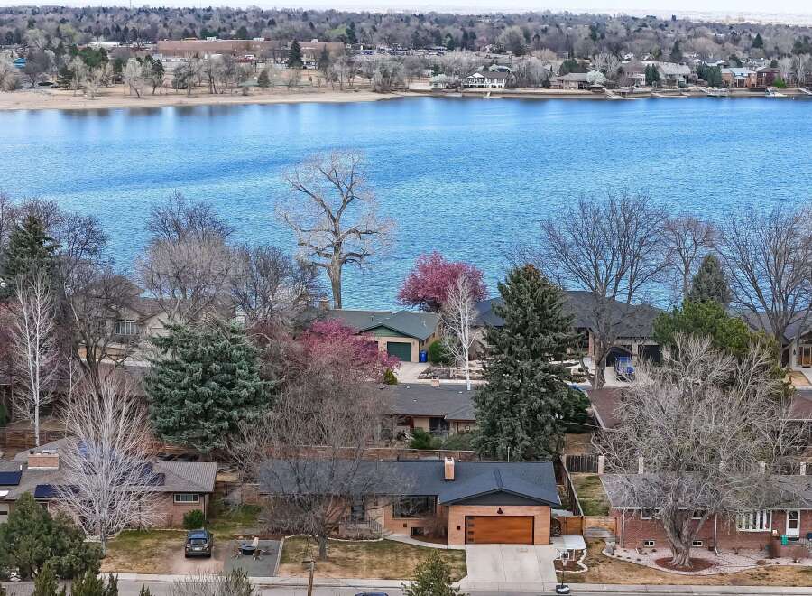Discover the charm of lakeside living in this stunning property! This home boasts a prime location with breathtaking views of the water, perfect for enjoying serene mornings and vibrant sunsets.