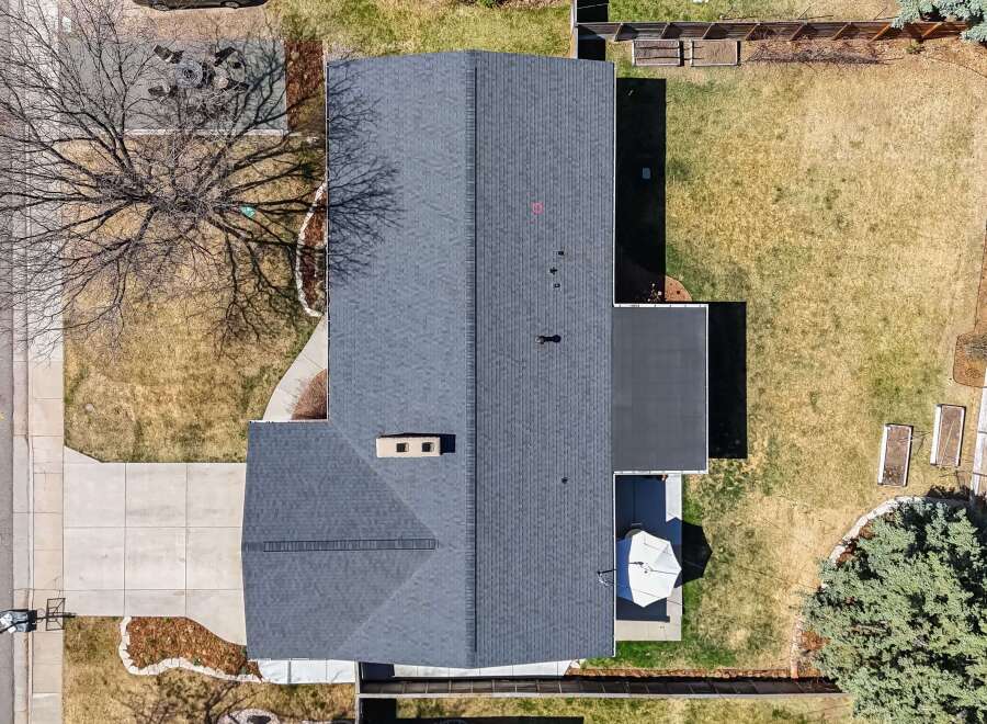 This stunning property boasts a beautifully maintained exterior with a modern roof and a spacious backyard.