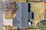 This stunning property boasts a beautifully maintained exterior with a modern roof and a spacious backyard.
