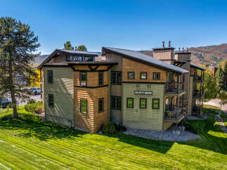 Discover luxury living at Northstar! This stunning property boasts a modern design with beautiful wood accents and multiple balconies.