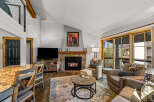 This stunning property boasts a cozy living room with a fireplace, perfect for relaxing evenings.