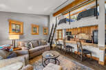 Discover the charm of this cozy cabin featuring a loft bedroom and a well-equipped kitchen.