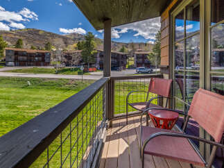Enjoy breathtaking mountain views from this charming balcony.