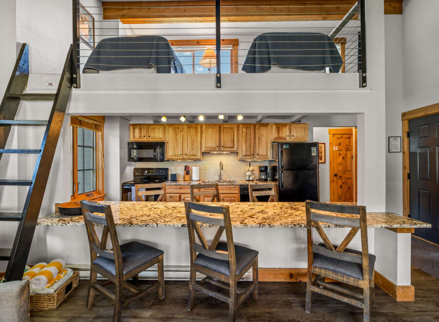 This stunning property boasts a modern kitchen with granite countertops and ample cabinet space, perfect for culinary enthusiasts.